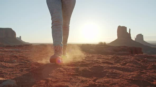 Happy Traveler Girl in Hiking Boots Walks Desert Nature Woman at Sunset in Park