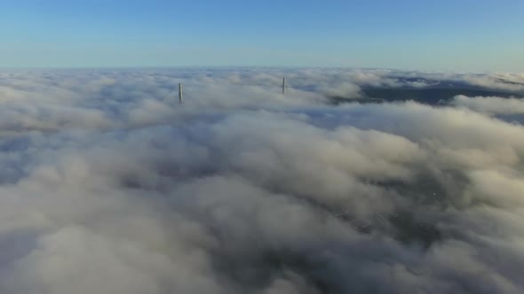 View From a Drone of the Bridge the Fog That Spreads Over the Ground