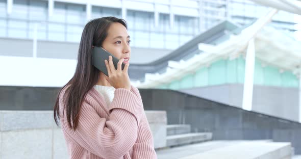 Woman talk to cellphone at outdoor