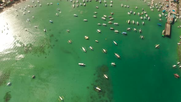 Tourist Boats in a Bay with Blue Water