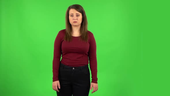 Upset Girl Shrugging and Shaking Her Head Negatively . Green Screen