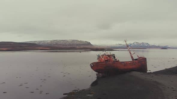 Rusty ship near river coast