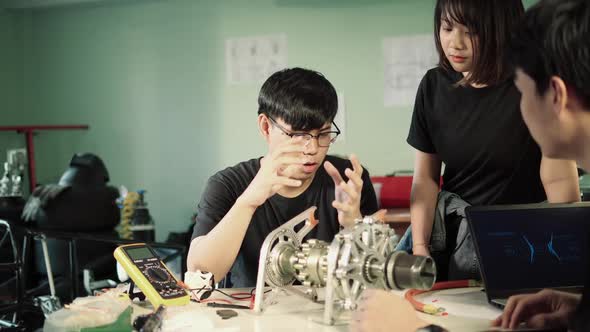 Student team learning engine parts