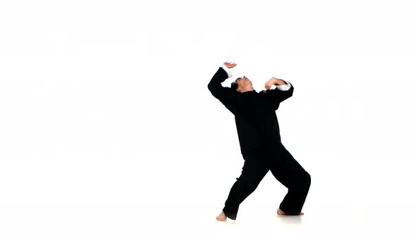 Wushu, Kungfu Man in Sportswear Performing a Kick