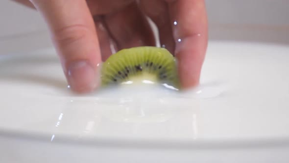 Pulling Kiwi From Milk