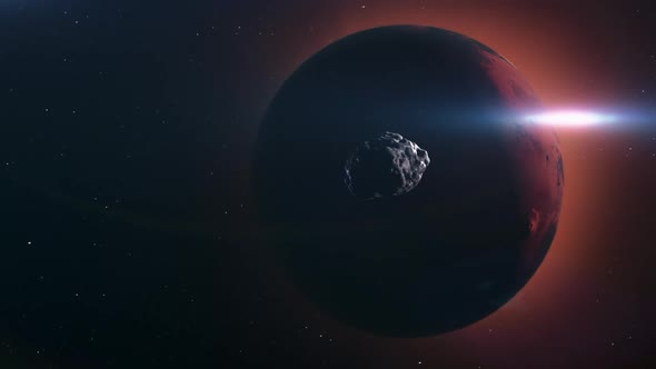 A meteorite is moving through space to meet the planet Mars. alt