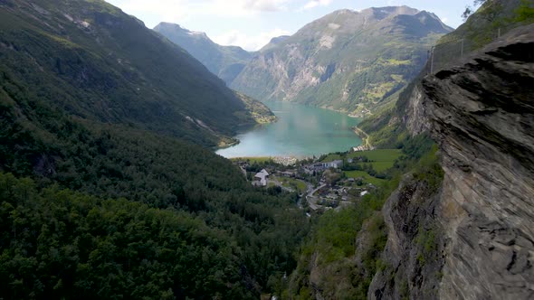 Serene Scenery From Geirangerfjord Norway Mountains and Emerald Sea Water - aerial shot