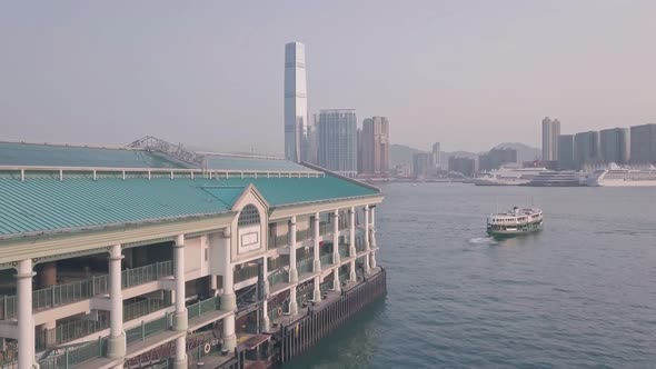 }Hong Kong star ferry, central terminal and harbour front. Aerial drone view