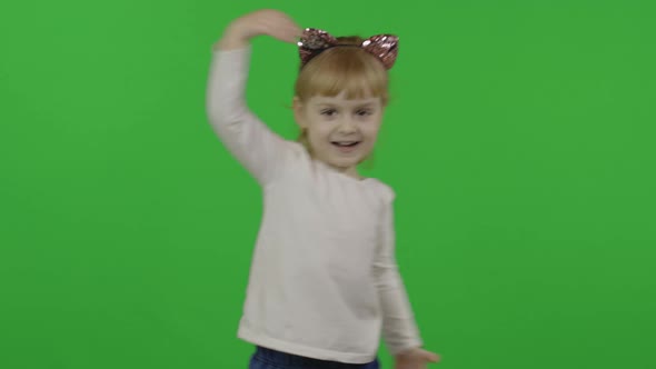 Girl in Headband with a Cat Ears Dancing