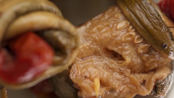 Vertical video: Canned eggplant in a red plate