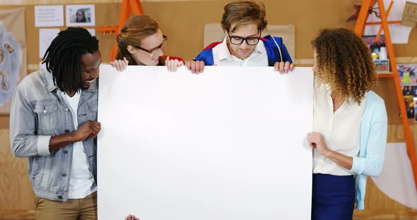 Business executives holding a blank placard