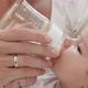 Mother bottle feeding baby girl - VideoHive Item for Sale