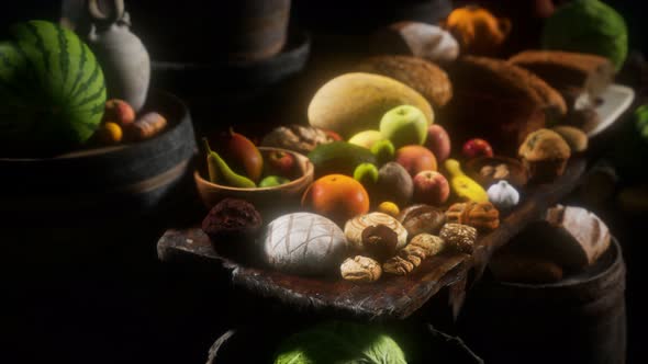 Food Table with Wine Barrels and Some Fruits, Vegetables and Bread