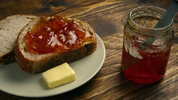 Plate Of Sliced Bread With Jam And Butter