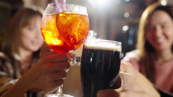 Group of Happy Multiethnic Friends Having Fun Together Drinking Bottled Beer in a Bar or at Home