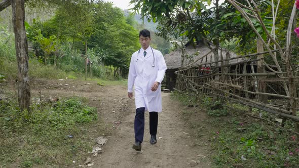 Rural Doctor Walking At Countryside