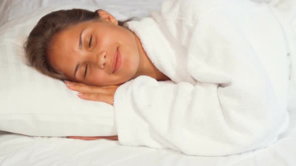 Beautiful Young Woman Smiling To the Camera While Falling Asleep