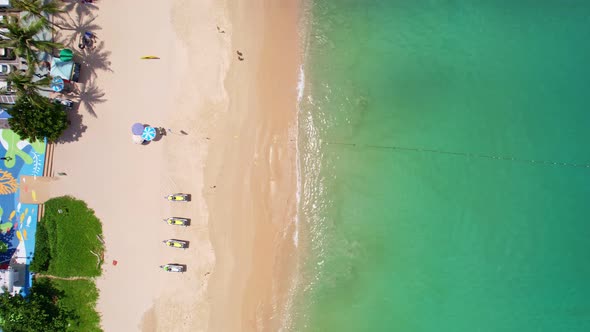 Aerial view of Phuket sea. Patong beach in summer season Amazing sea beach with ocean wave foams