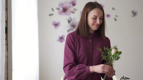 Woman Florist Makes Bouquet of Flowers in Workshop