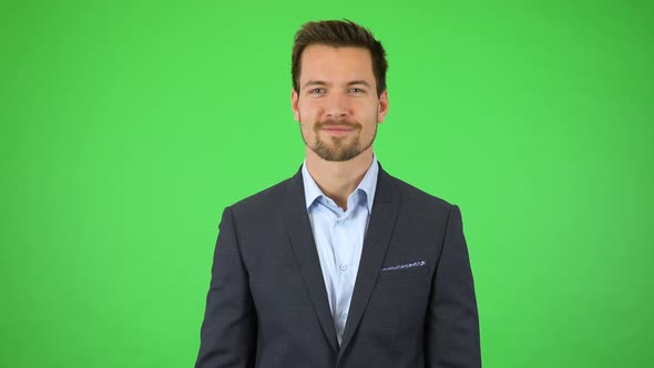 A Businessman Looks Around in Astonishment at Objects Falling Around Him, Then Smiles - Green Screen