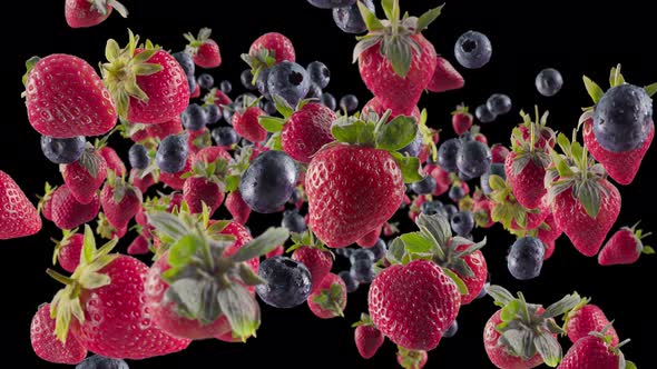 Burst of Strawberry Blueberry in Black Background