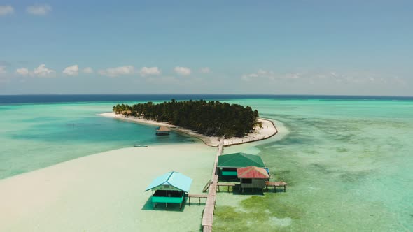 Tropical Island with Beach and Atoll with Coral Reef