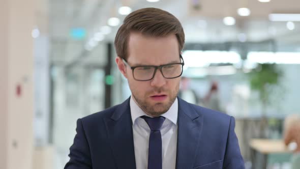 Portrait of Allergic Young Businessman Coughing