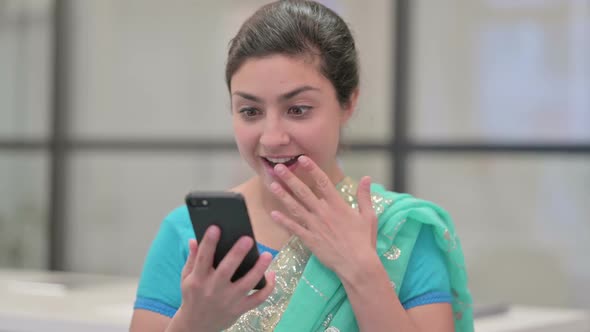 Portrait of Indian Woman Celebrating on Smartphone