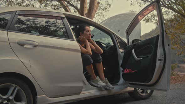 Woman Having Car Troubles on the Road