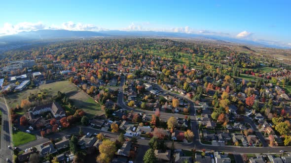 Aerial Flying Above Autumn Colorful Trees In City Of Medford Oregon Usa