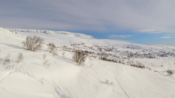 Aerial View Of Snowy Mountain Hill At Winter In Haugastol, Norway.