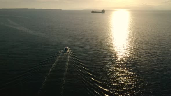 Fishing Boat And Cargo Ship Aerial