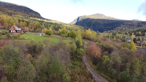 View of a Beautiful Forest Village Village Railway Bird's Eye View of the Landscape Drone Camera