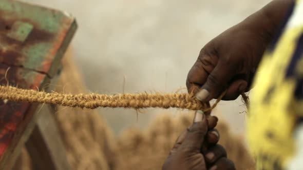 Village Woman Hand Weaving Rope