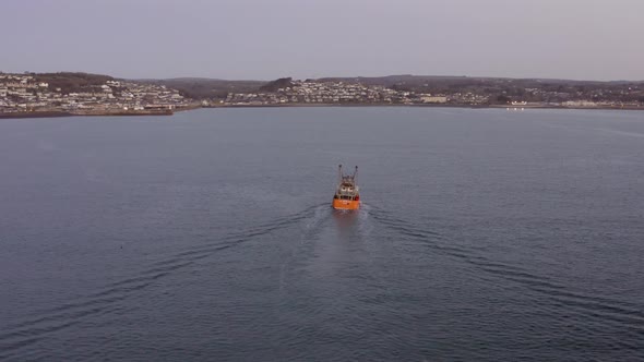 Fishing Boat at Sunrise out at Sea