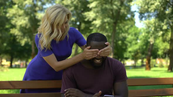 Joyful Female Covering Boyfriends Eyes From Behind in Park, Happy Relationship