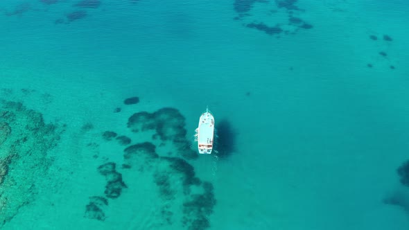 Aerial View of a Boat in the Blue Sea