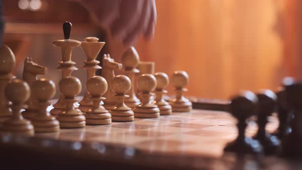 Pawn Move on Wooden Chessboard