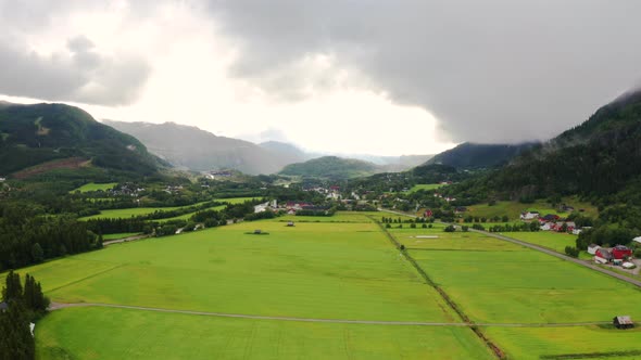 Wide aerial view of the open valley fields in rural Hemsedal, Norway.