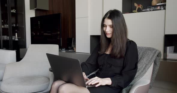 Young Adult Business Woman Typing on Laptop Computer Working in Internet