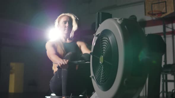 Woman Weightlifter Does Strength Exercises on Treadmill