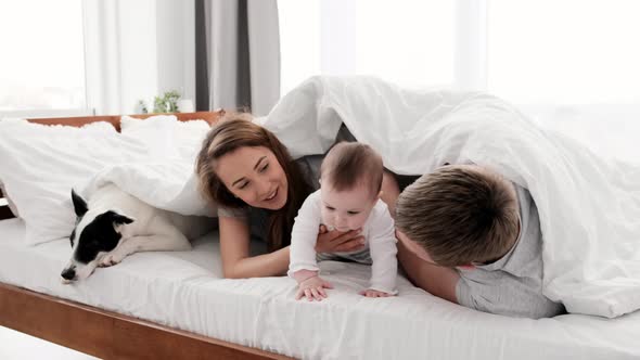 Family with Dog in the Bed