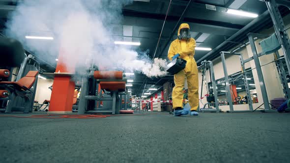 Sanitary Worker Is Fumigating Chemicals in the Gym