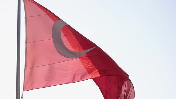 Turkish Flag on Flagpole Waving in the Wind