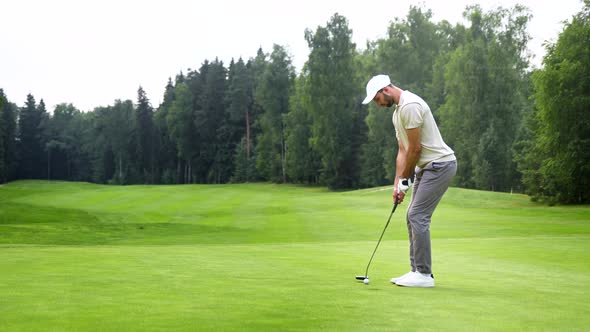 Young golfer in uniform playing golf