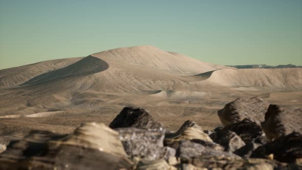 Aerial View on Big Sand Dunes in Sahara Desert at Sunrise alt