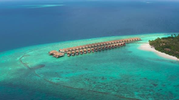 Aerial View of Luxury Water Villas Resort on Maldives Island