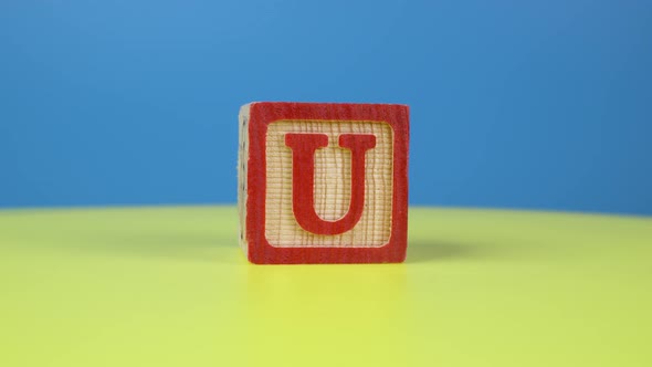 Close up shot letter "U" alphabet wooden block