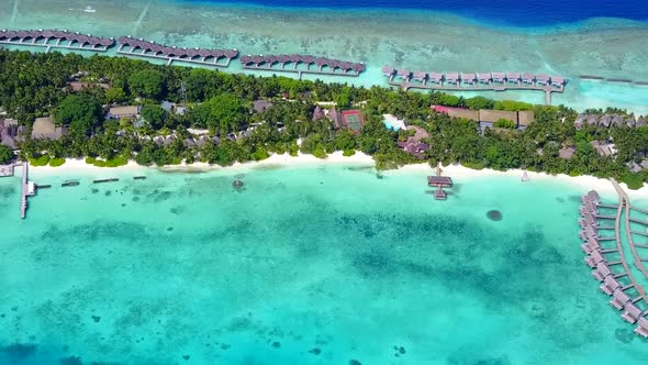 Drone view landscape of resort beach by water with sand background