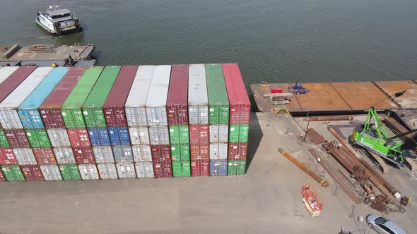Stacked Of Colorful Containers At The Seaport Terminal Of Dordrecht, Netherlands - Drone, Pan Left